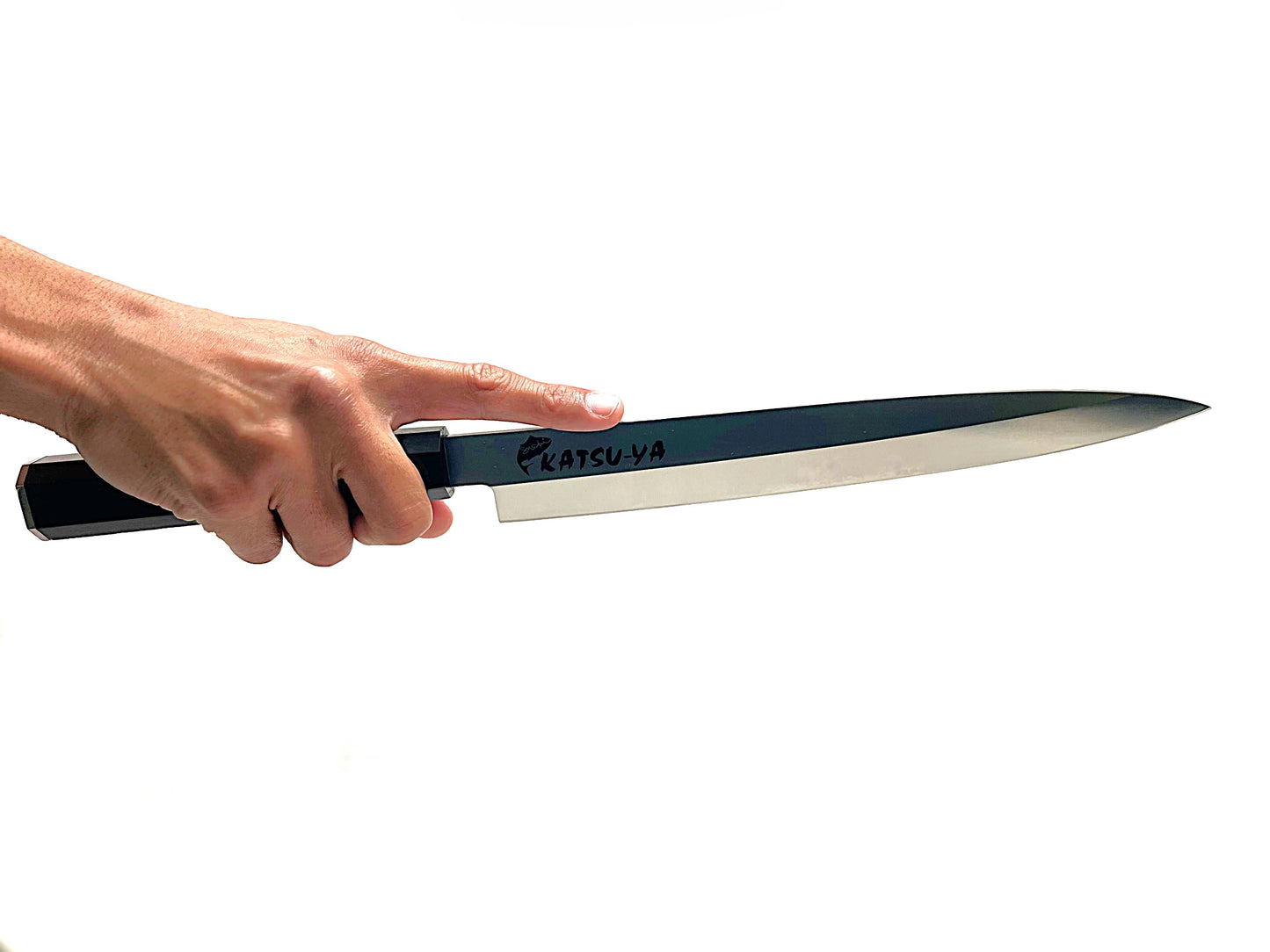 Hand holding 270mm knife